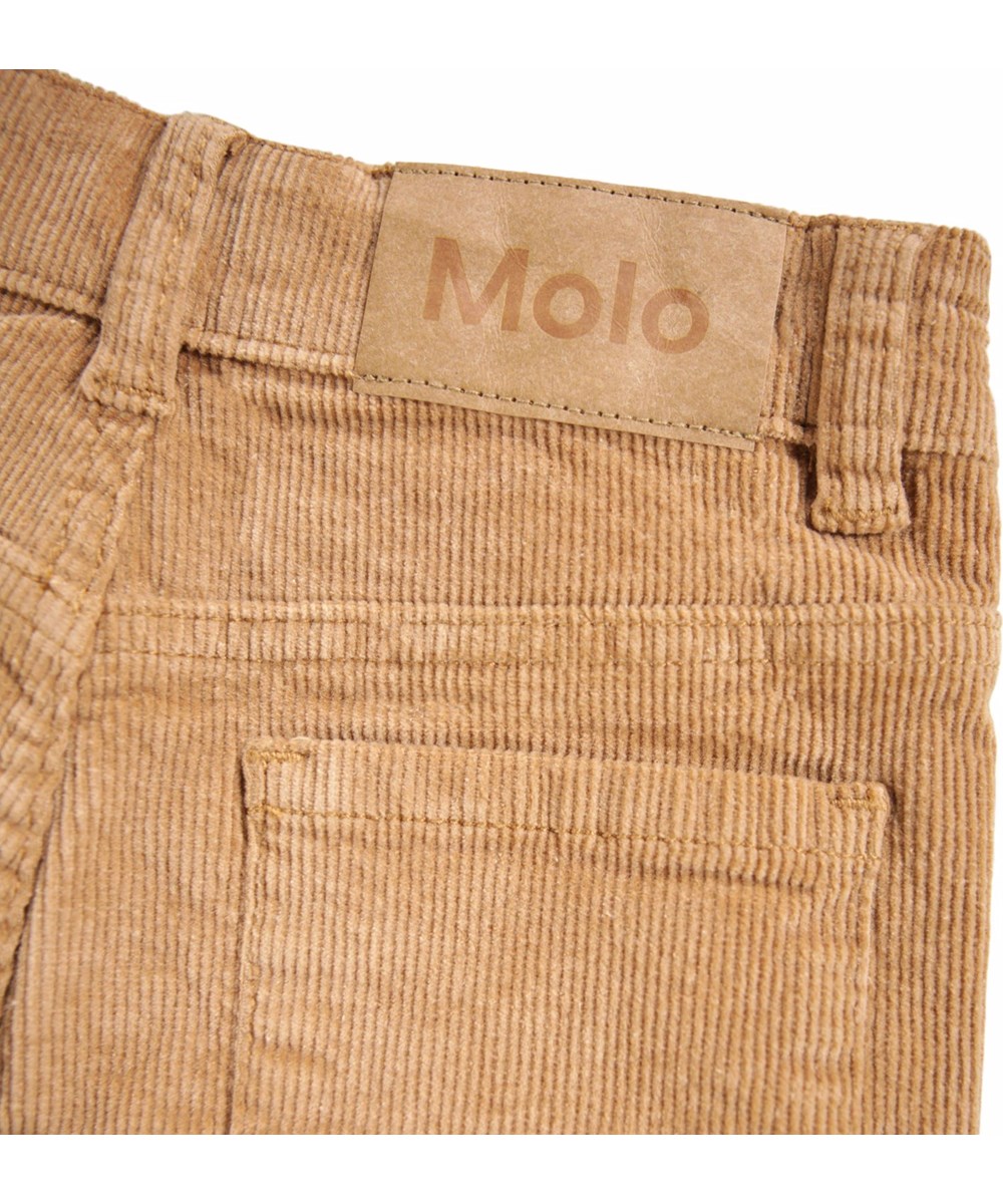 Aida - Pomeranian - Light brown pants for children made of soft cotton velvet in a trumpet-shaped silhouette.