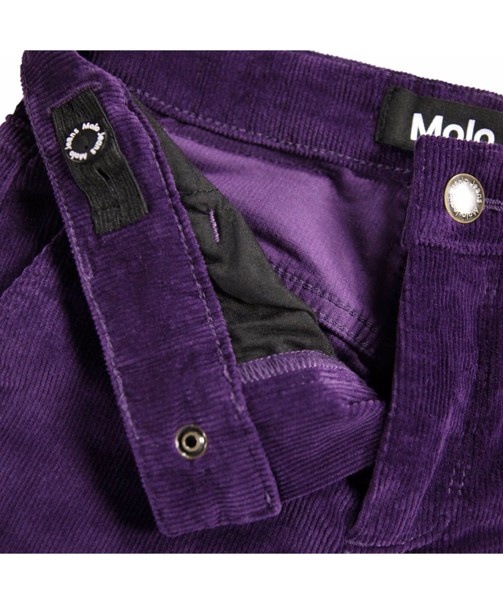 Aida - Space Purple - Purple pants for children mae of soft cotton velvet in a trumpet-shaped silhouette.
