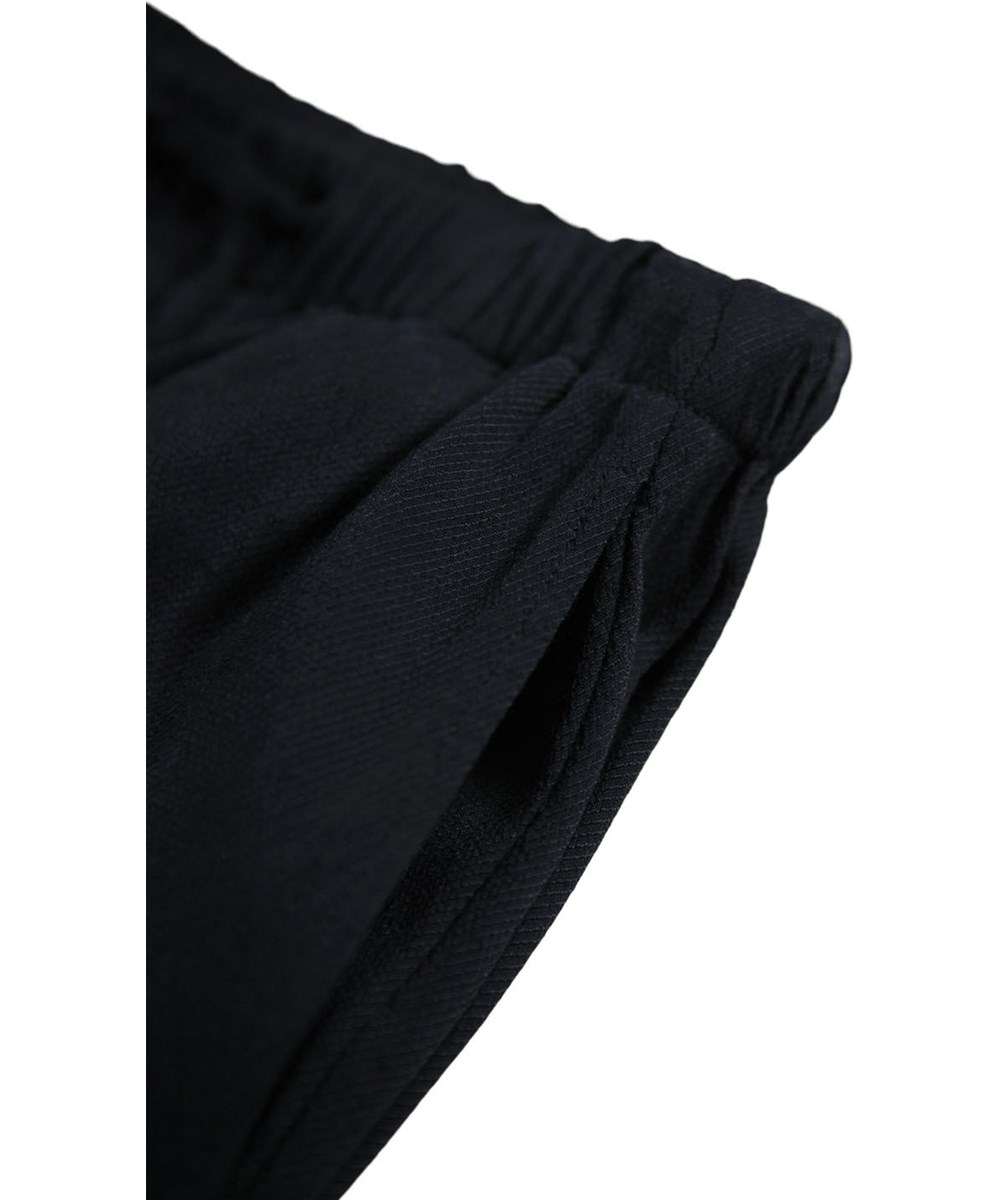 Ala - Black - Soft black pants for children made of viscose with a loose fit in pyjama style.