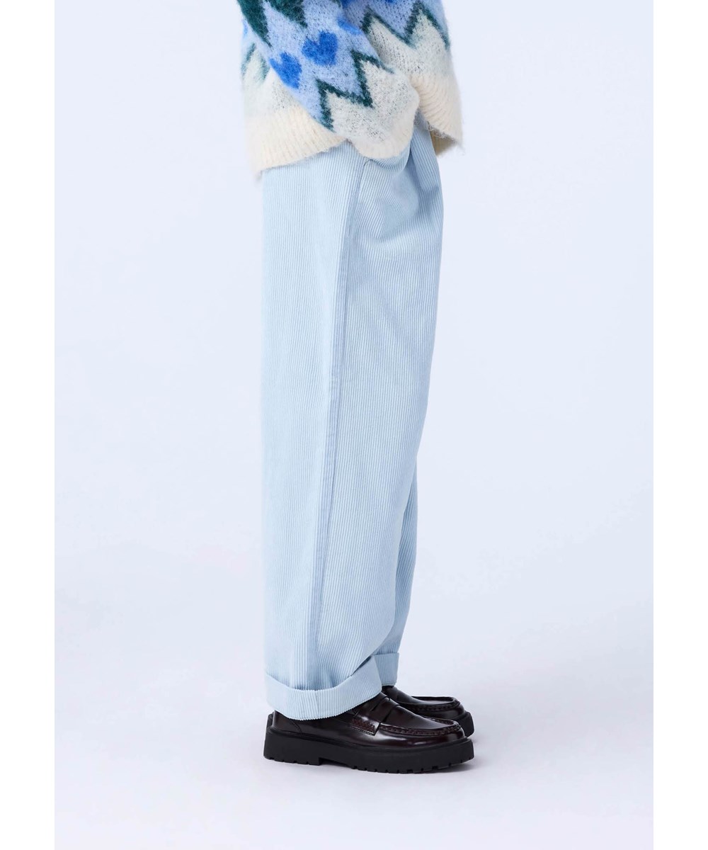 Alaine - Blue Moon - Light blue pants for children made of soft cotton velvet in a loose fit.