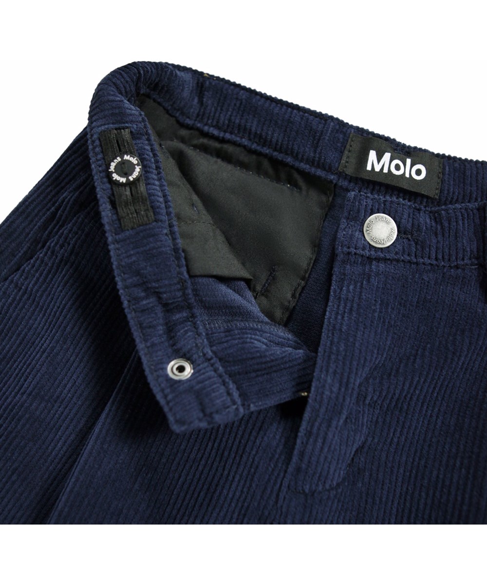 Alaine - Galaxy Blue - Dark blue pants for children made of soft cotton velvet in a loose fit.