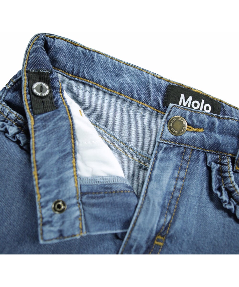 Amara - Blue Vintage - Soft blue denim pants for children made of a viscose and cotton blend.