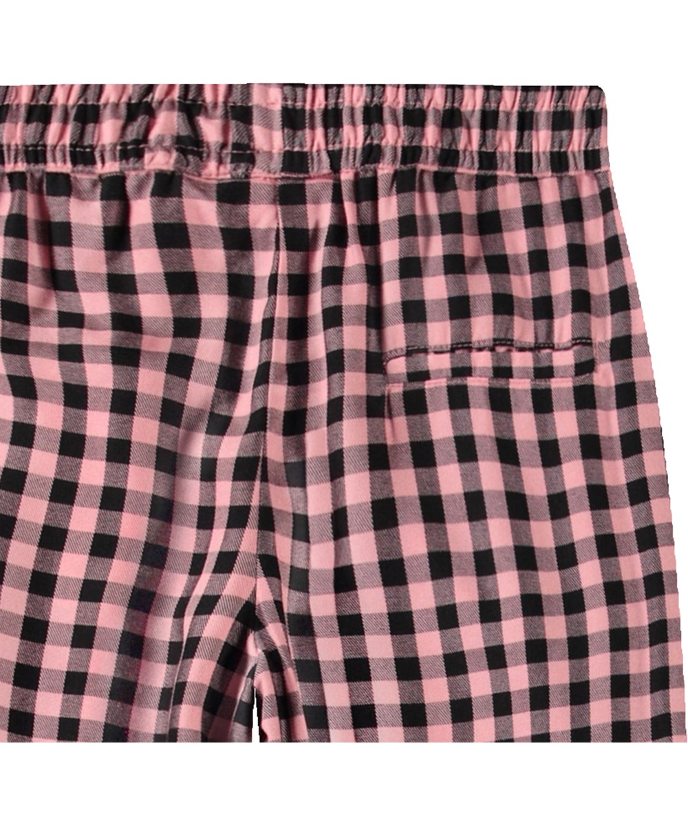 Ami - Rose Ginham - Black and pink checkered trousers for children in soft viscose.