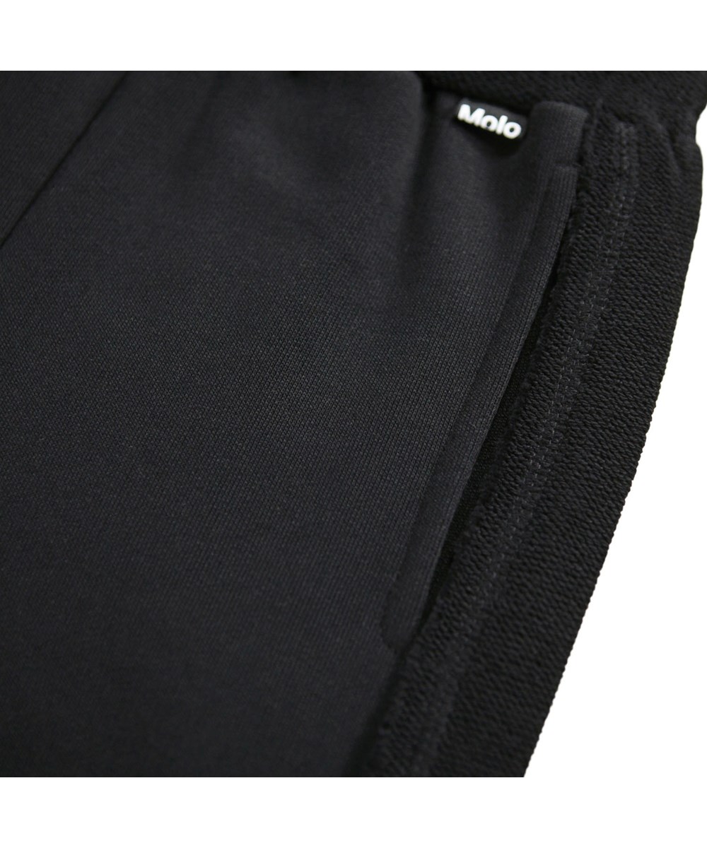Amlia - Black - Black sweatpants for children made of organic cotton.