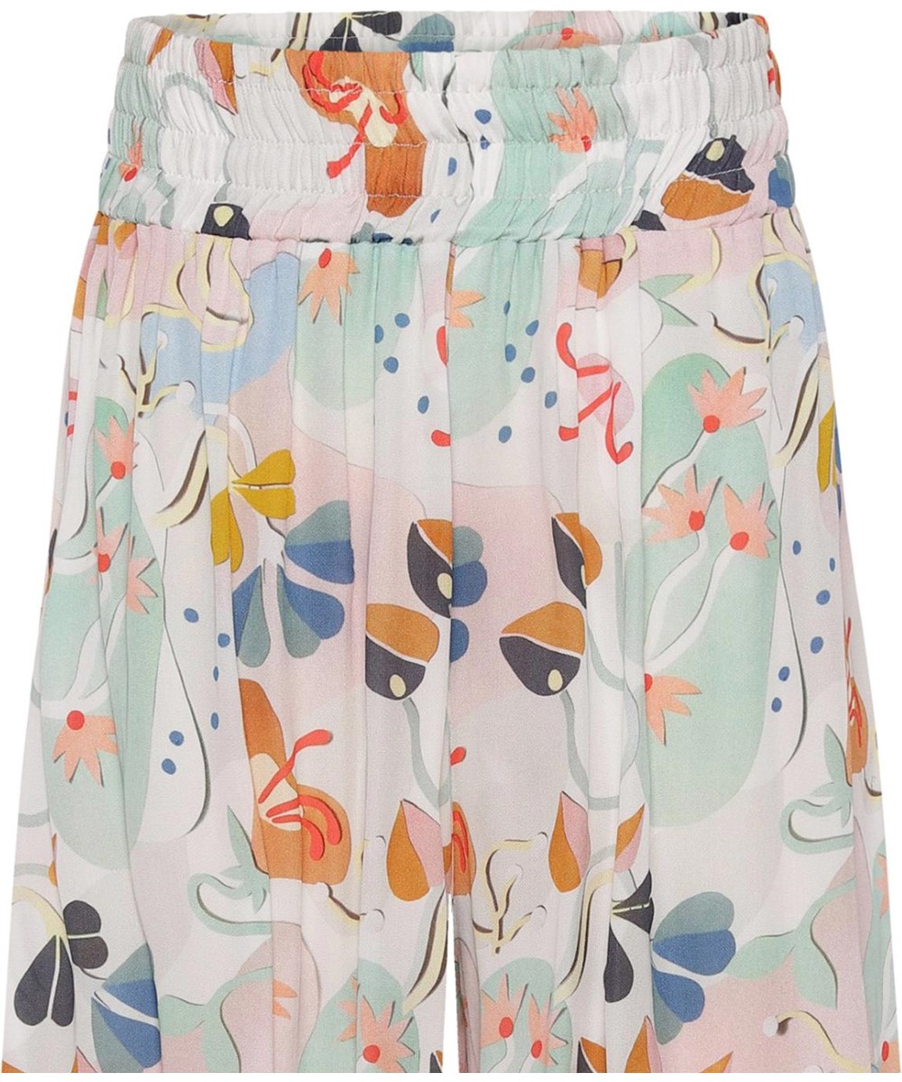 Antonya - Papercut Flowers - Wide pastel coloured trousers with print 