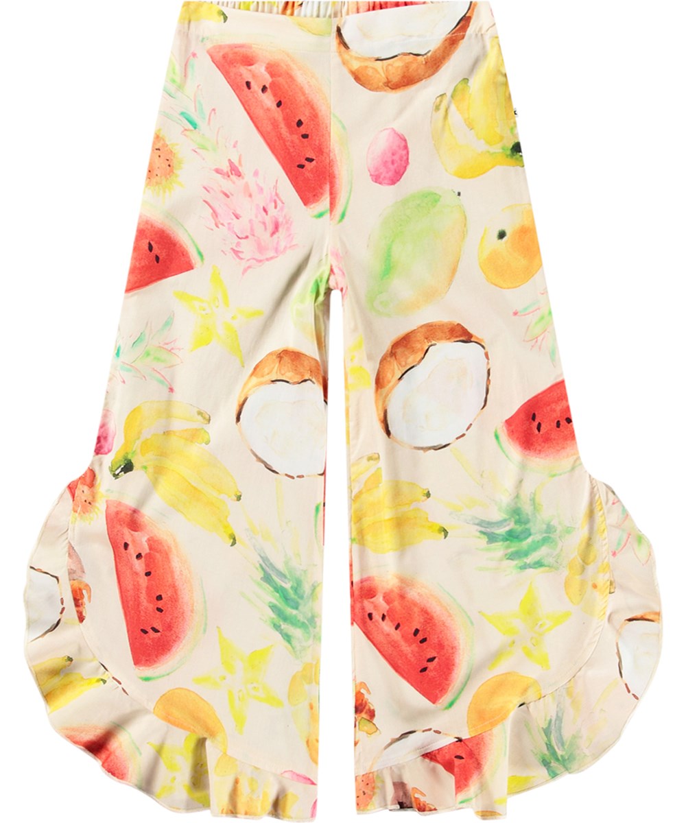Aretha - Painted Fruits - Airy pants for children with ruffle edge made from organic cotton.