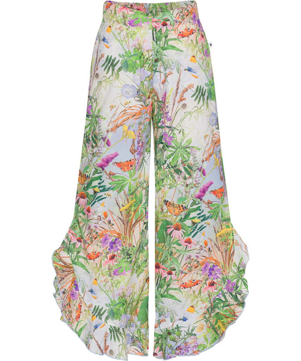 Aretha - Wild Nature - Airy trousers in organic cotton with a floral print and ruffles