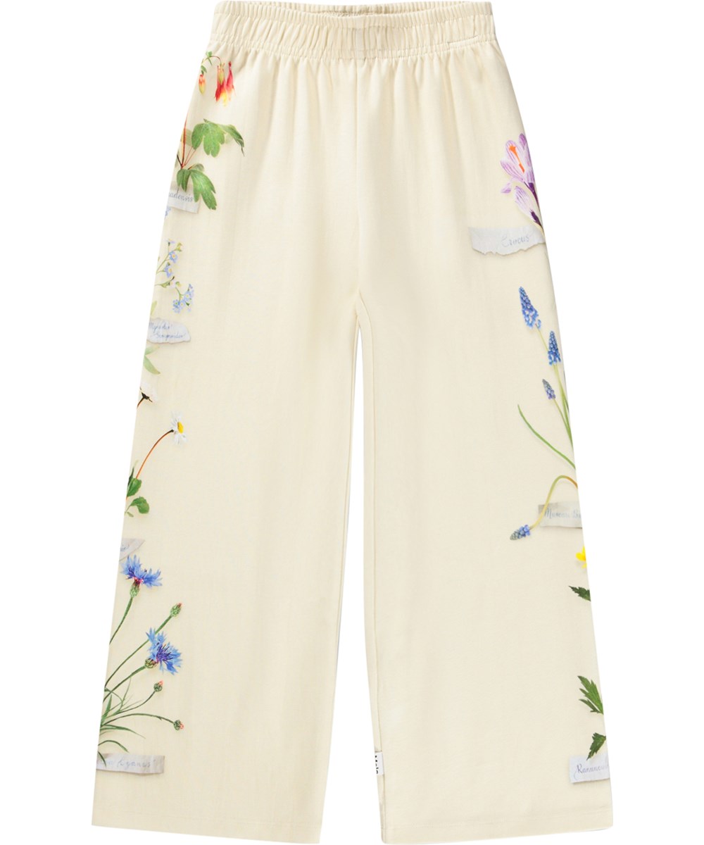 Aurita - Flora Collector - Off-white jersey trousers made of organic cotton with a floral print 
