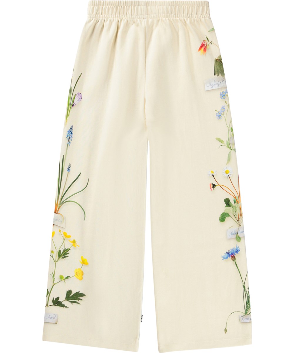 Aurita - Flora Collector - Off-white jersey trousers made of organic cotton with a floral print 