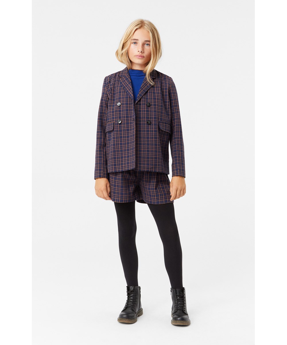 Alysie - Bluebrown Check - High-waisted brown and blue plaid shorts with front pockets.