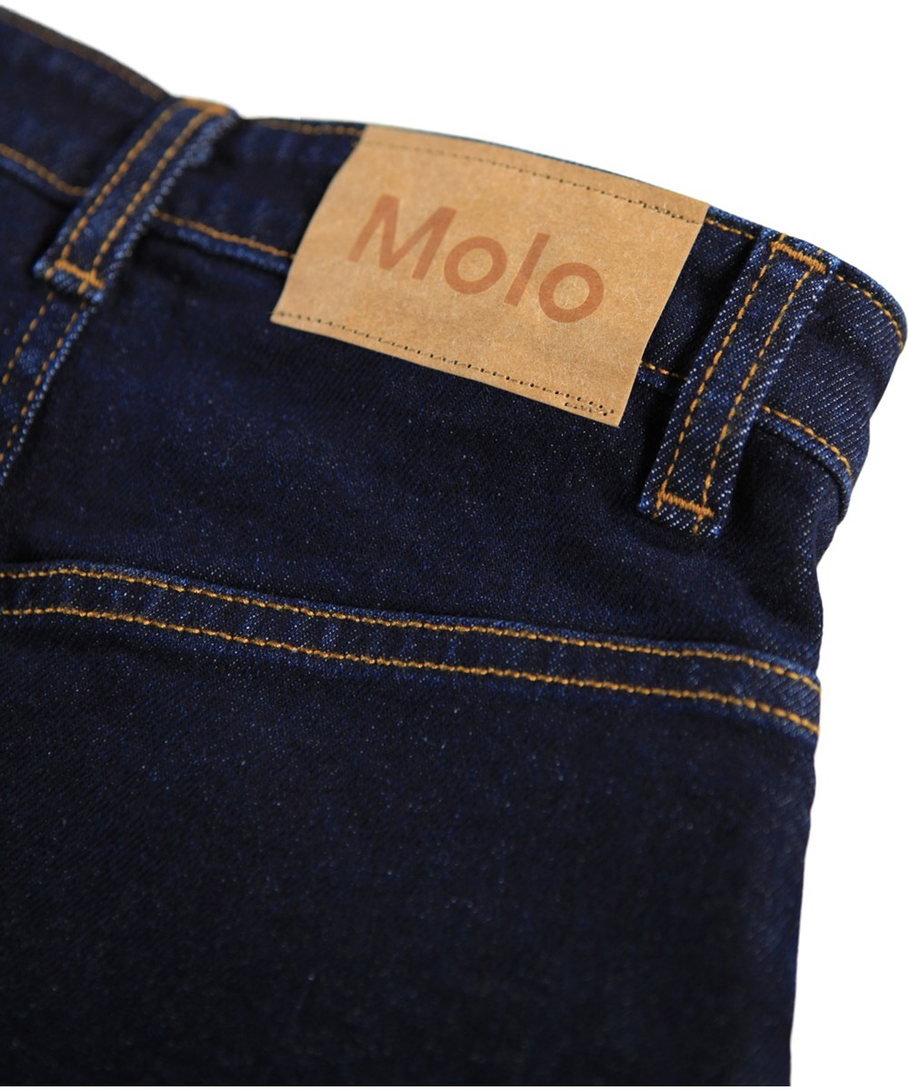 Baji - Raw Blue - Denim skirt for children in dark blue with copper-colored stitching.