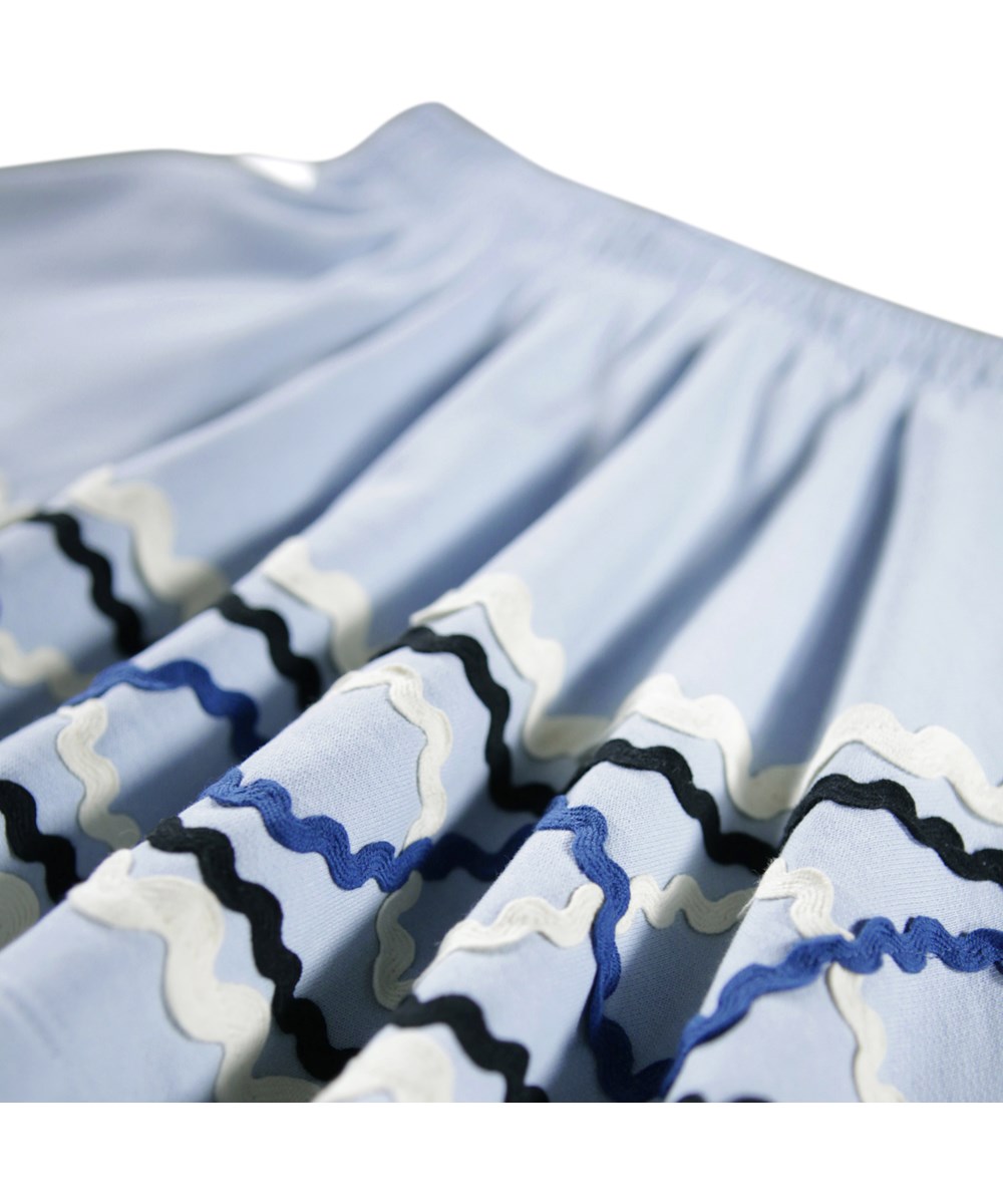 Barbera - Blue Moon - Light blue skirt for children made of organic cotton with colourful sewn-on ribbons.