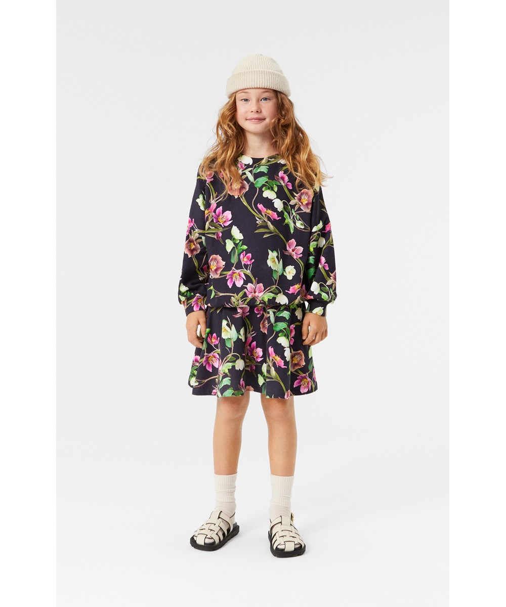 Barbera - Hellebore Black - Black organic cotton skirt with elastic waistband and flower print.