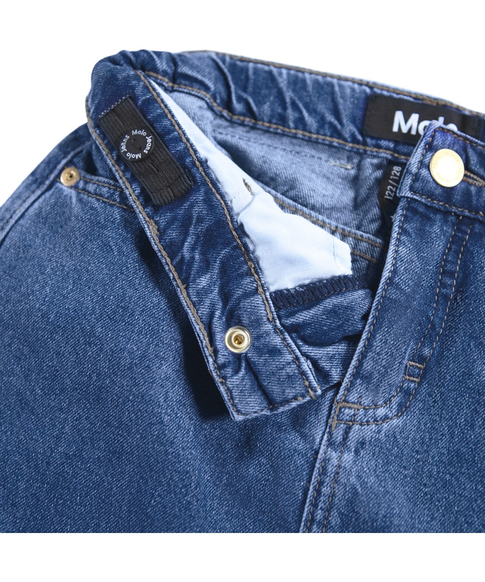 Belinda - Mid Blue Denim - Blue denim skirt for children made of organic cotton with ruffle edge.