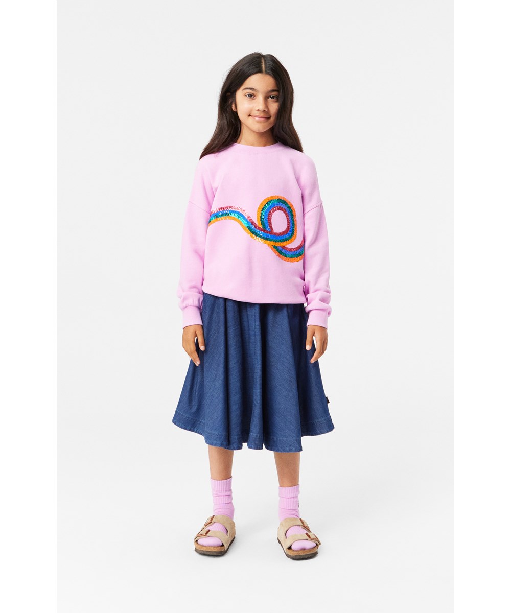 Bell - Mid Blue Wash - Blue denim A-line skirt in organic cotton with side seam pockets.