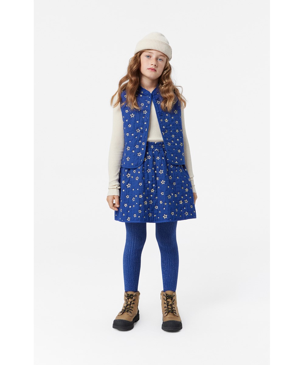 Benedicte - Shiny Stars - Exclusive navy quilted skirt with embroidered gold stars.