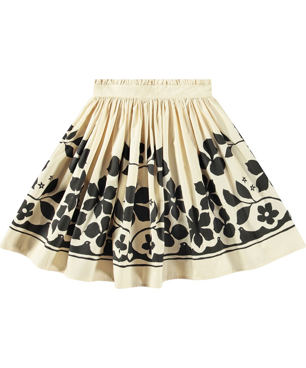 Bev - Pale Folklore - Knee-length off-white skirt with black flower print in organic cotton.