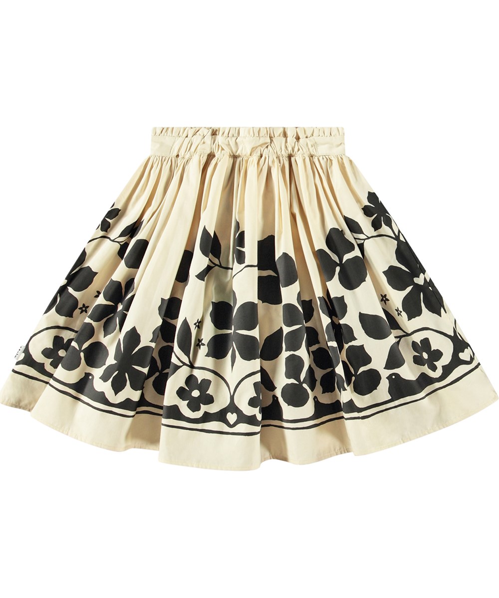 Bev - Pale Folklore - Knee-length off-white skirt with black flower print in organic cotton.