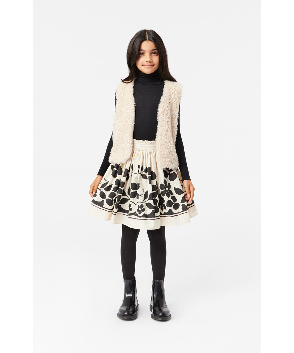 Bev - Pale Folklore - Knee-length off-white skirt with black flower print in organic cotton.