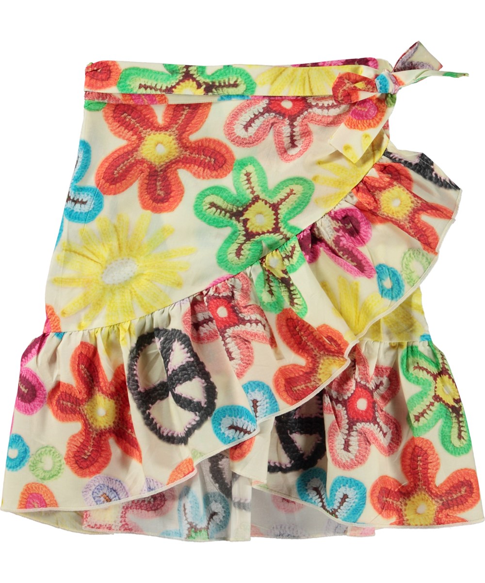 Bina - Flower Peace - Wrap skirt in organic cotton with a print of crocheted flowers and peace signs