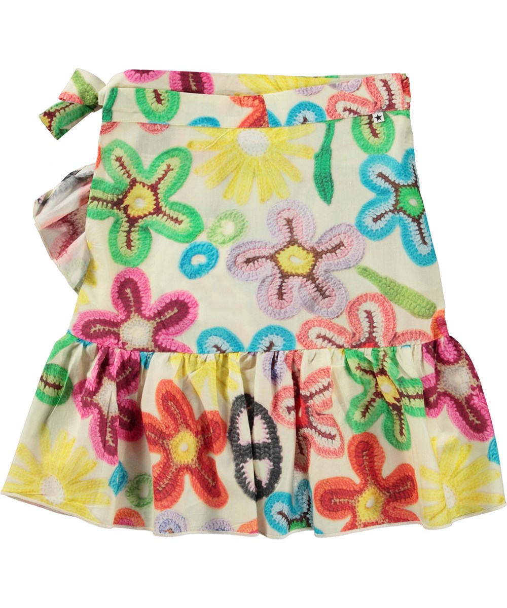 Bina - Flower Peace - Wrap skirt in organic cotton with a print of crocheted flowers and peace signs