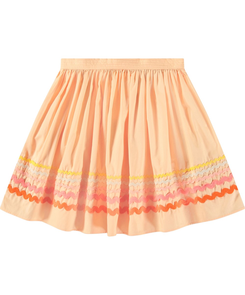 Bini - Pale Melon - Peach-coloured skirt in organic cotton for children. Multi-coloured wavy-effect trim at the bottom of the skirt.