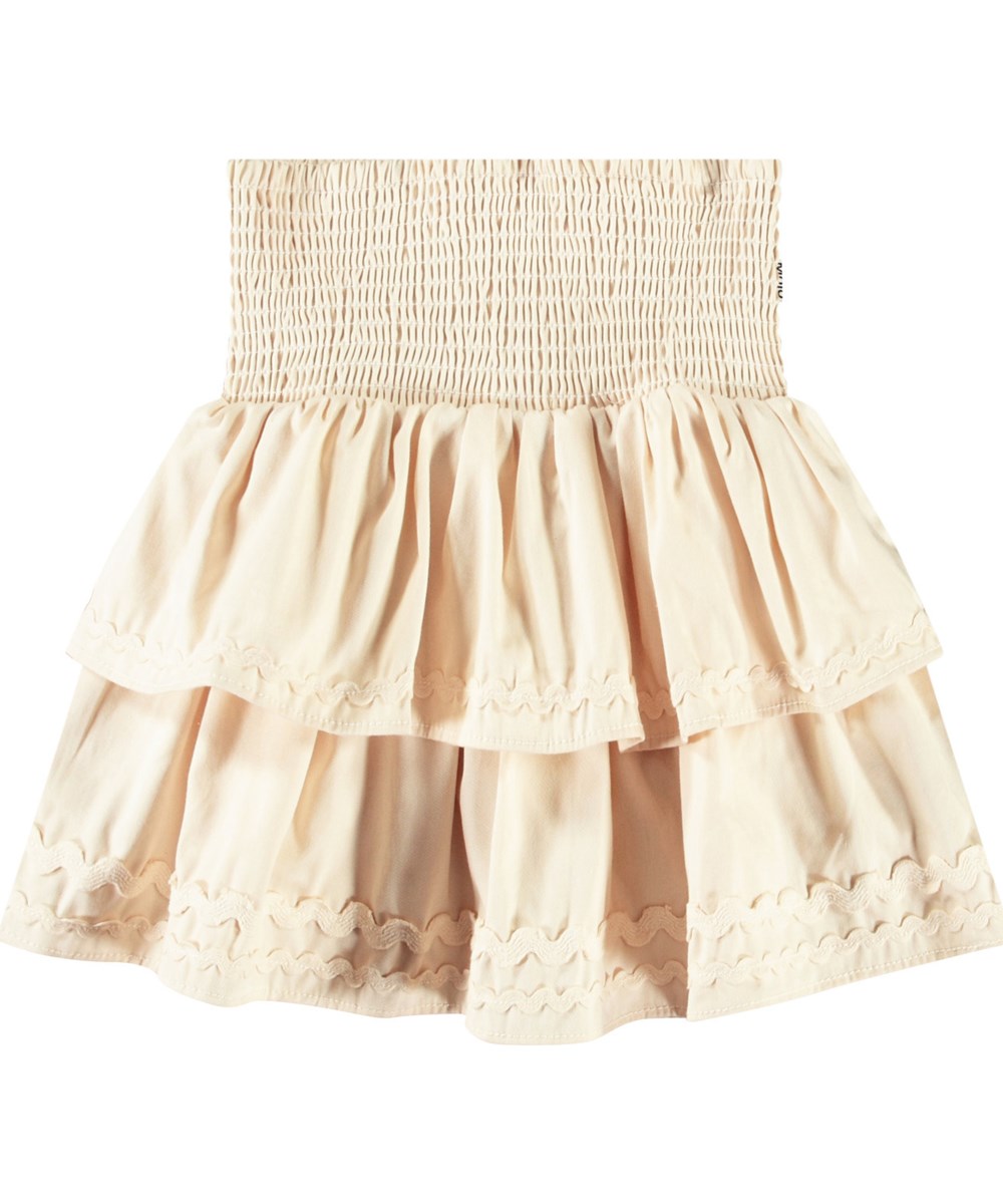 Bonita - Brazilian Sand - Beige knee-length skirt in organic cotton chambray with smocking for children.