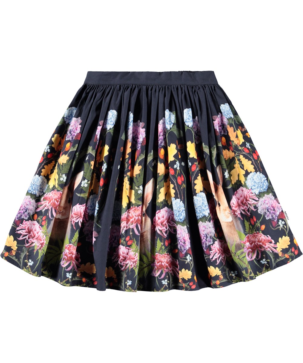 Bonnie - Nouveau Rabbit - Dark blue knee-length skirt for children made of organic cotton with a print of flowers and rabbits.