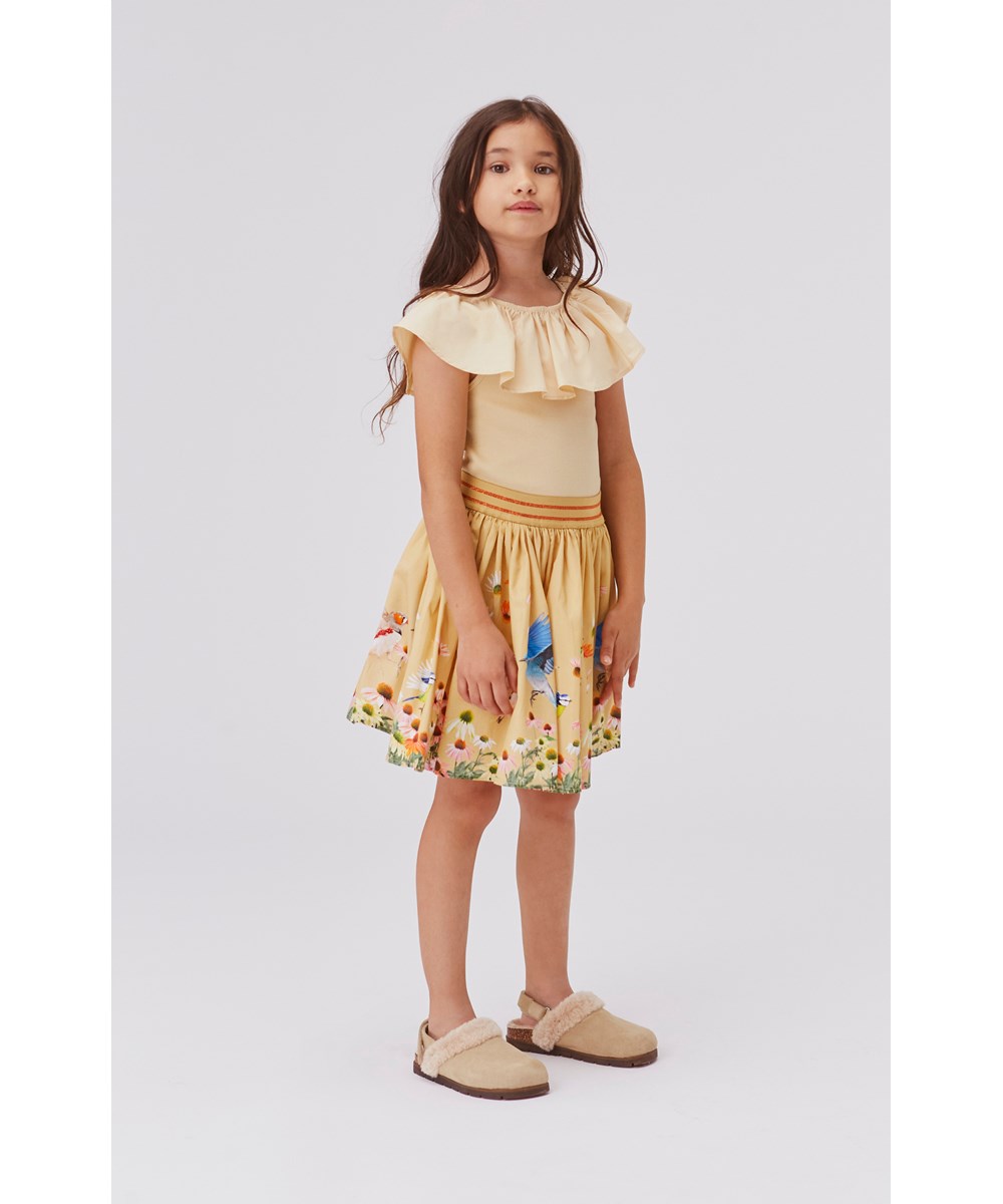 Brenda - Flower Field - Light yellow organic skirt with flowers and birds