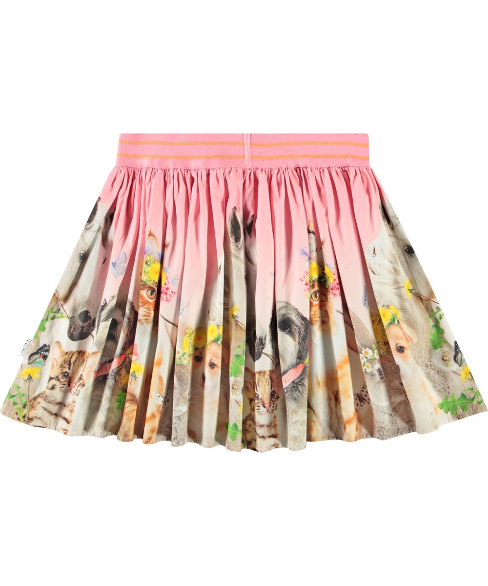 Brenda - Midsummer - Pink circular-cut skirt in organic cotton for children. The skirt features a print of cute baby animals with flower crowns.