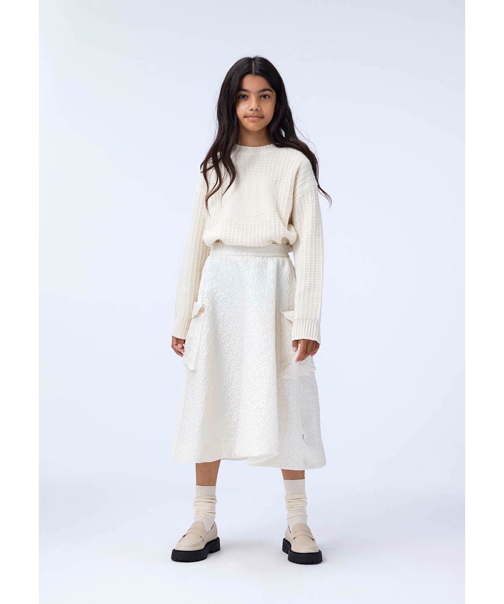 Brina - Buttercream - Off- white voluminous skirt with floral pattern.