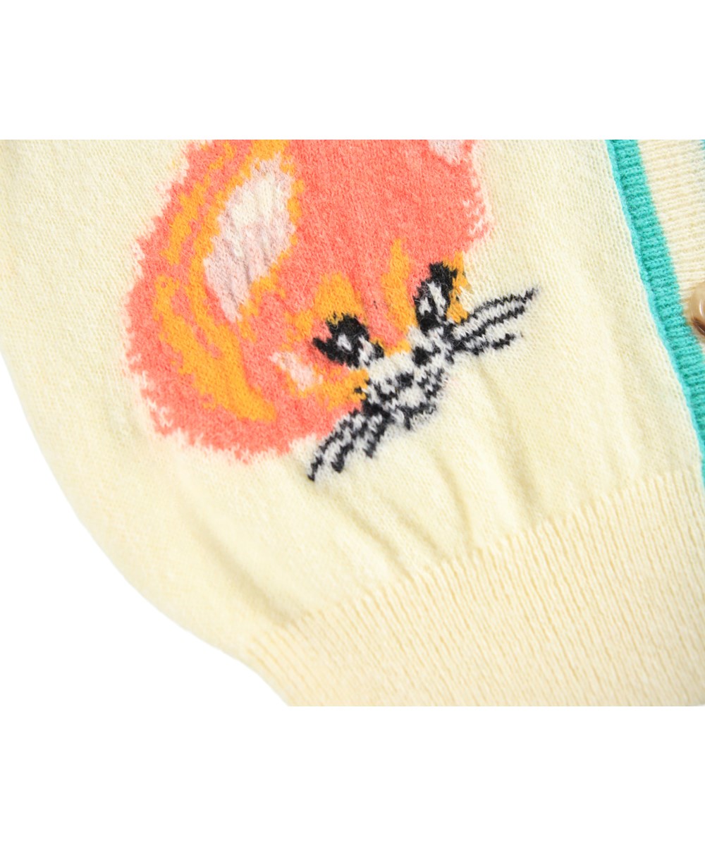 Gaby - Buttercream - Fun off-white cardigan for children made of a wool blend with an animal pattern.