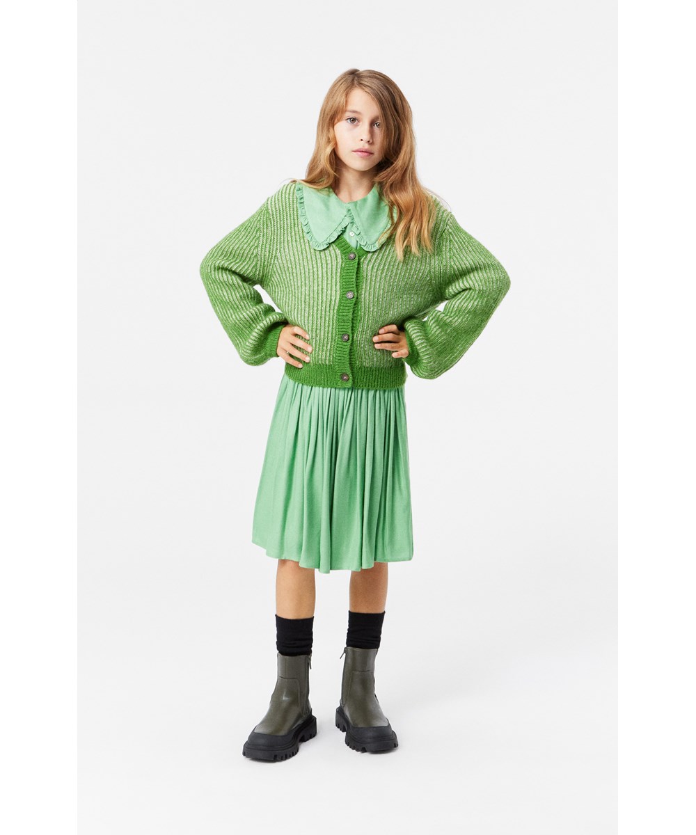 Gia - Jadesheen - Green and off-white wool blend cardigan with ribbed neckline and button placket.