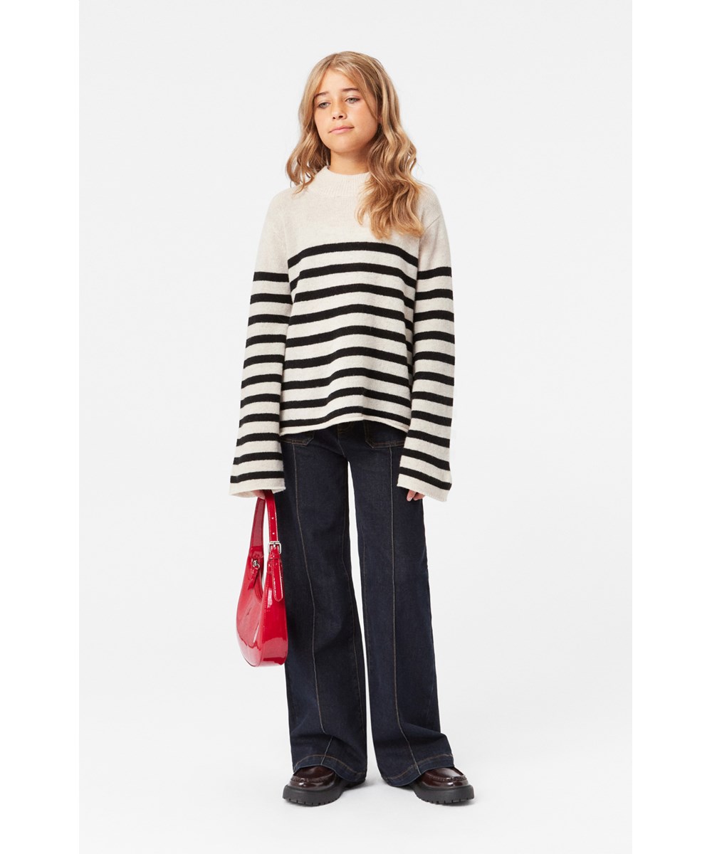Govina - Whisper Black - Soft wool beige and black striped knitted jumper with trumpet sleeves.