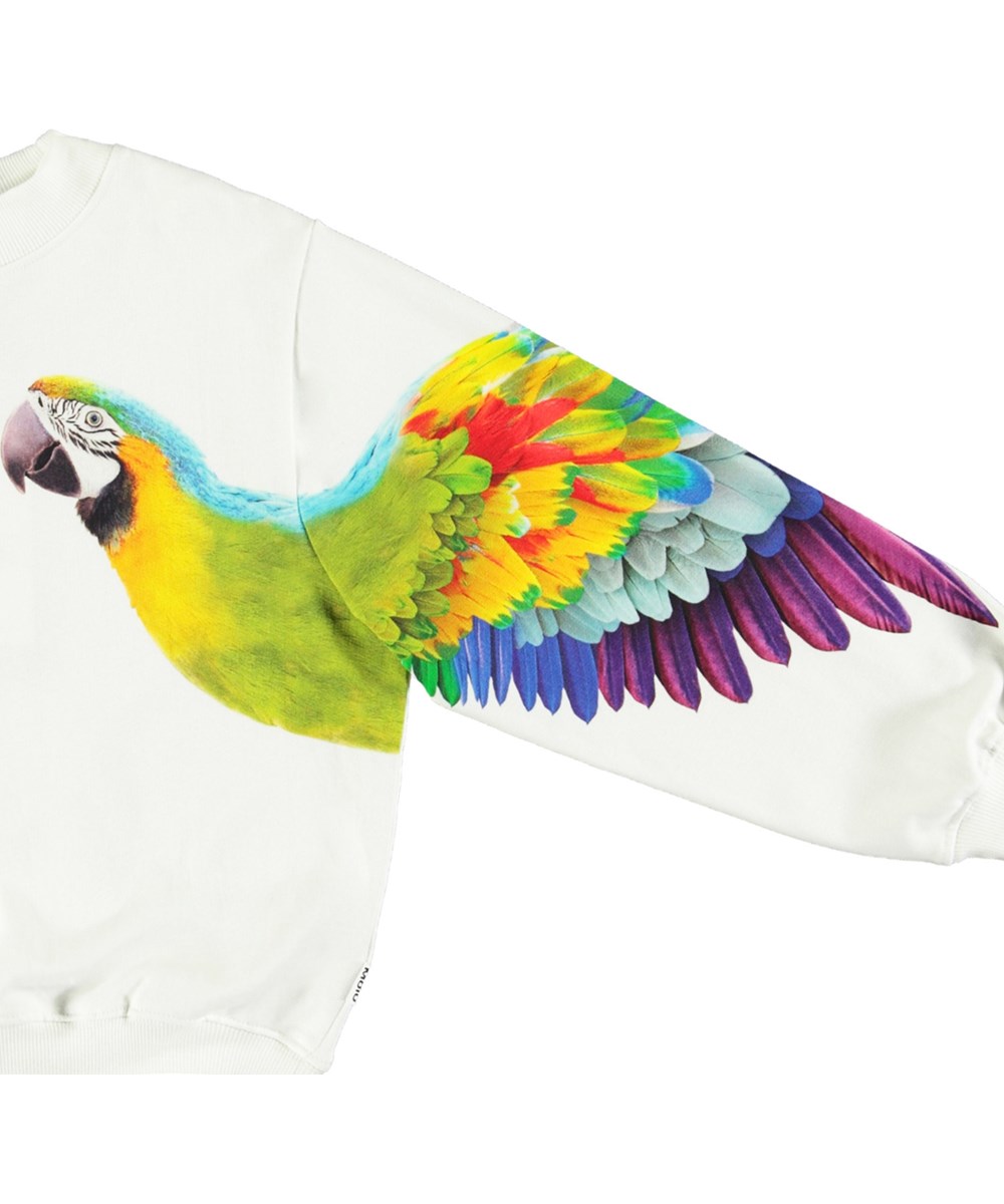 Marge - Magic Parrots - White sweatshirt with print for children in soft organic cotton with ribbed edges at the neck, sleeves, and at the bottom of the sweatshirt.