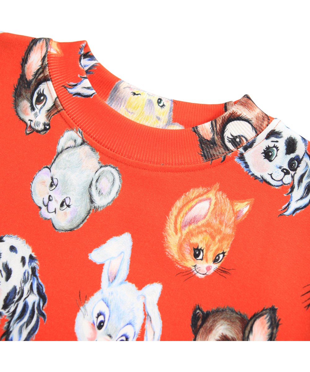 Marge - Rising Sun - Orange sweatshirt made of organic cotton with a print of cute drawn animals.