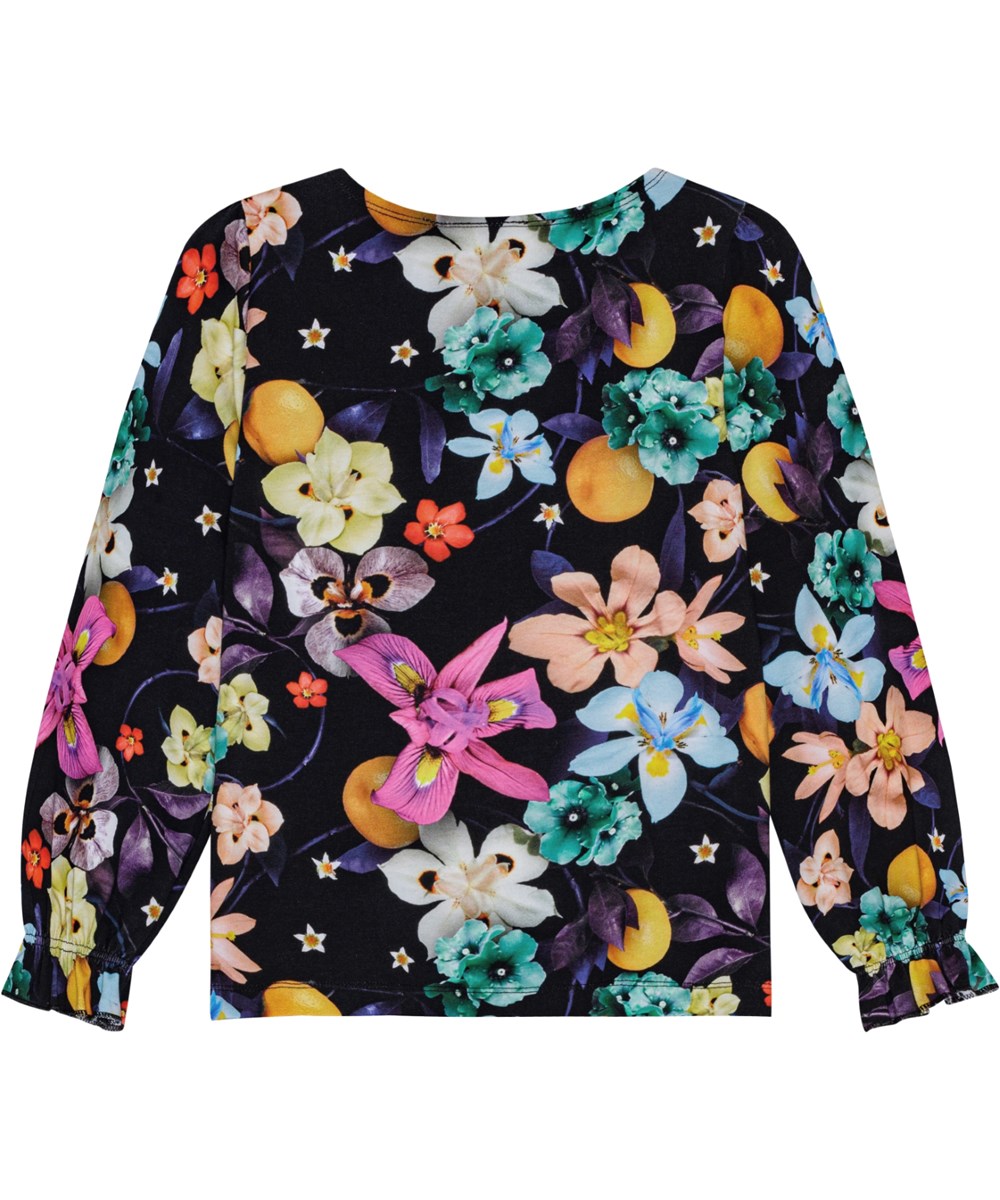 Raina - Garden Of Plenty - Black long-sleeved organic cotton top with colourful flower print. Round neckline.