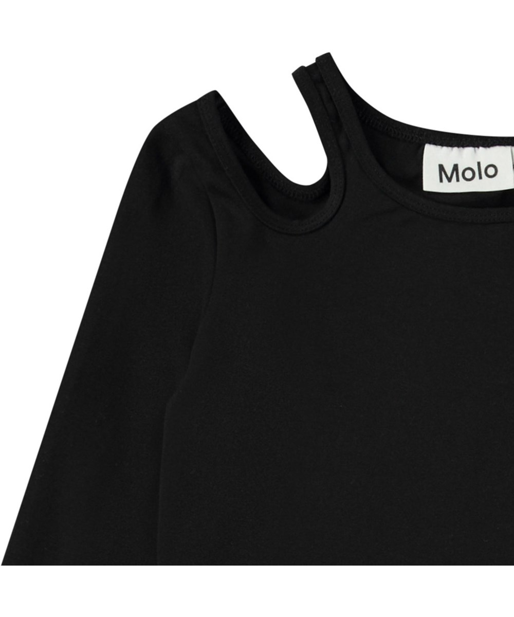 Ramona - Black - Fitted black long-sleeved top in organic cotton with a round neck and open on the right shoulder.