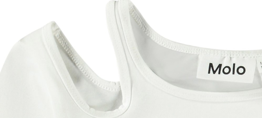 Ramona - Crisp White - Fitted white long-sleeved top in organic cotton with a round neck and open on the right shoulder.