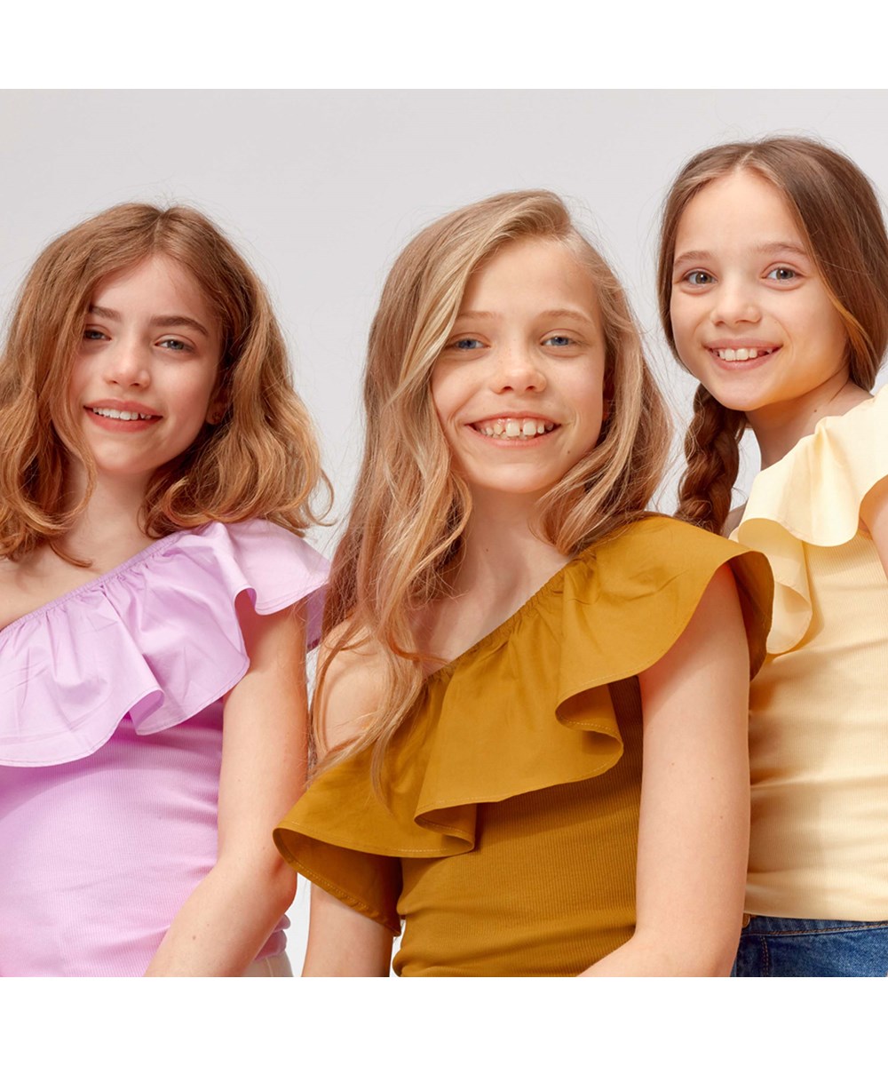 Rebecca - Almond - Brown asymmetrical top with ruffle edge