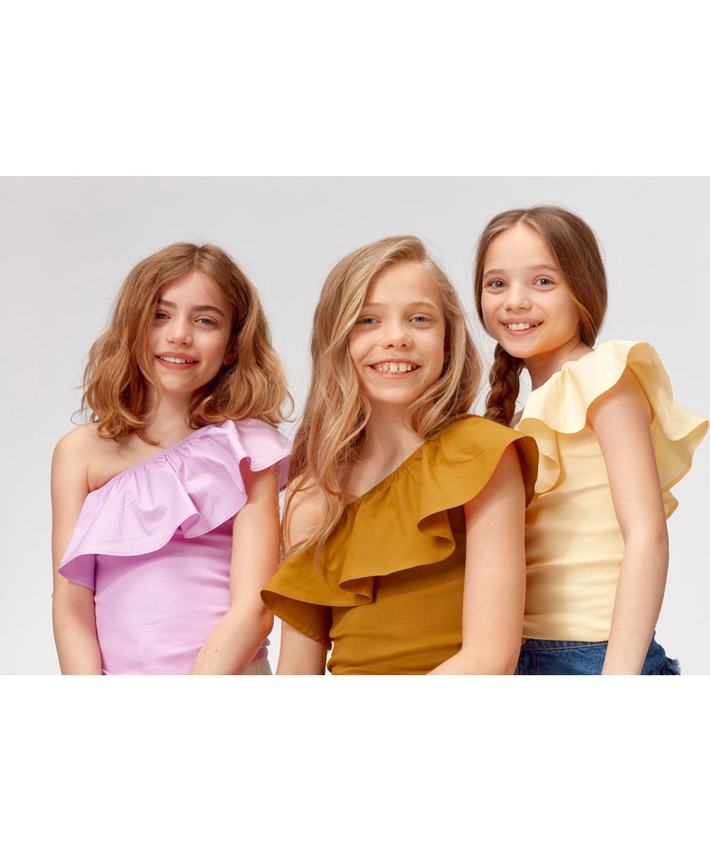 Rebecca - Impala - Light yellow asymmetrical top with ruffle edge