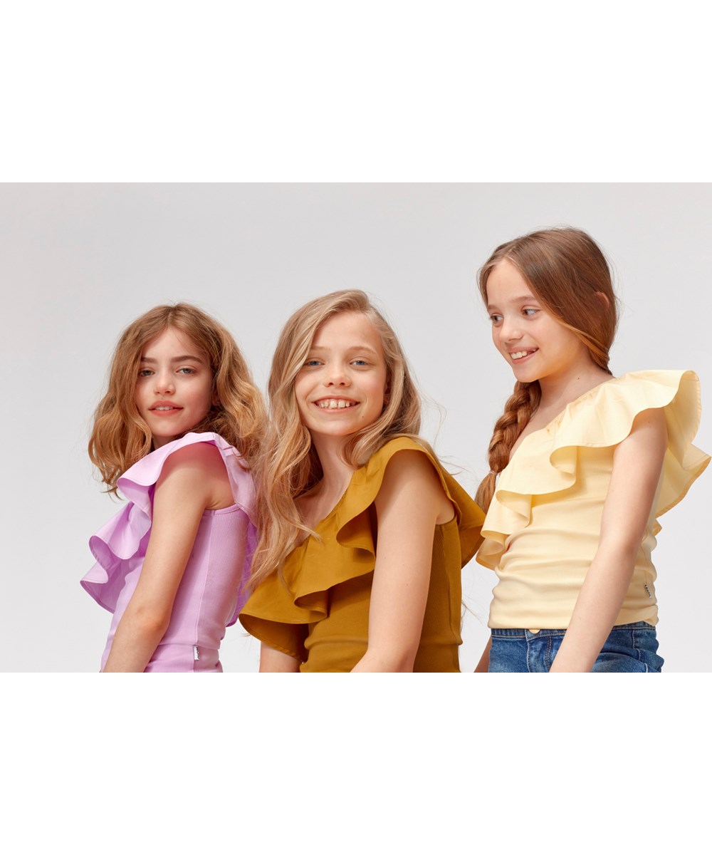 Rebecca - Impala - Light yellow asymmetrical top with ruffle edge