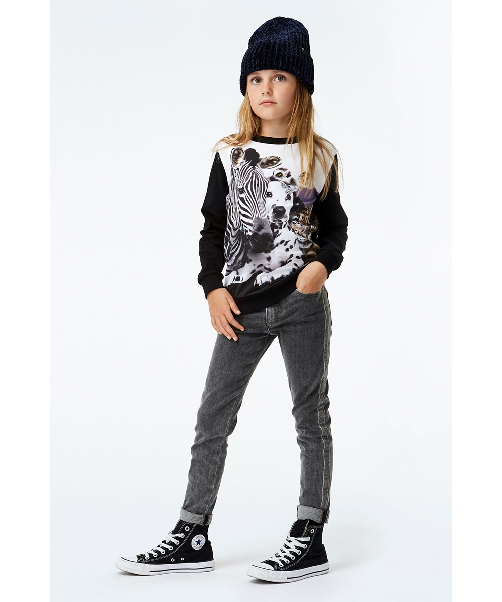 Regine - Cheek To Cheek - Black organic top with animal print 