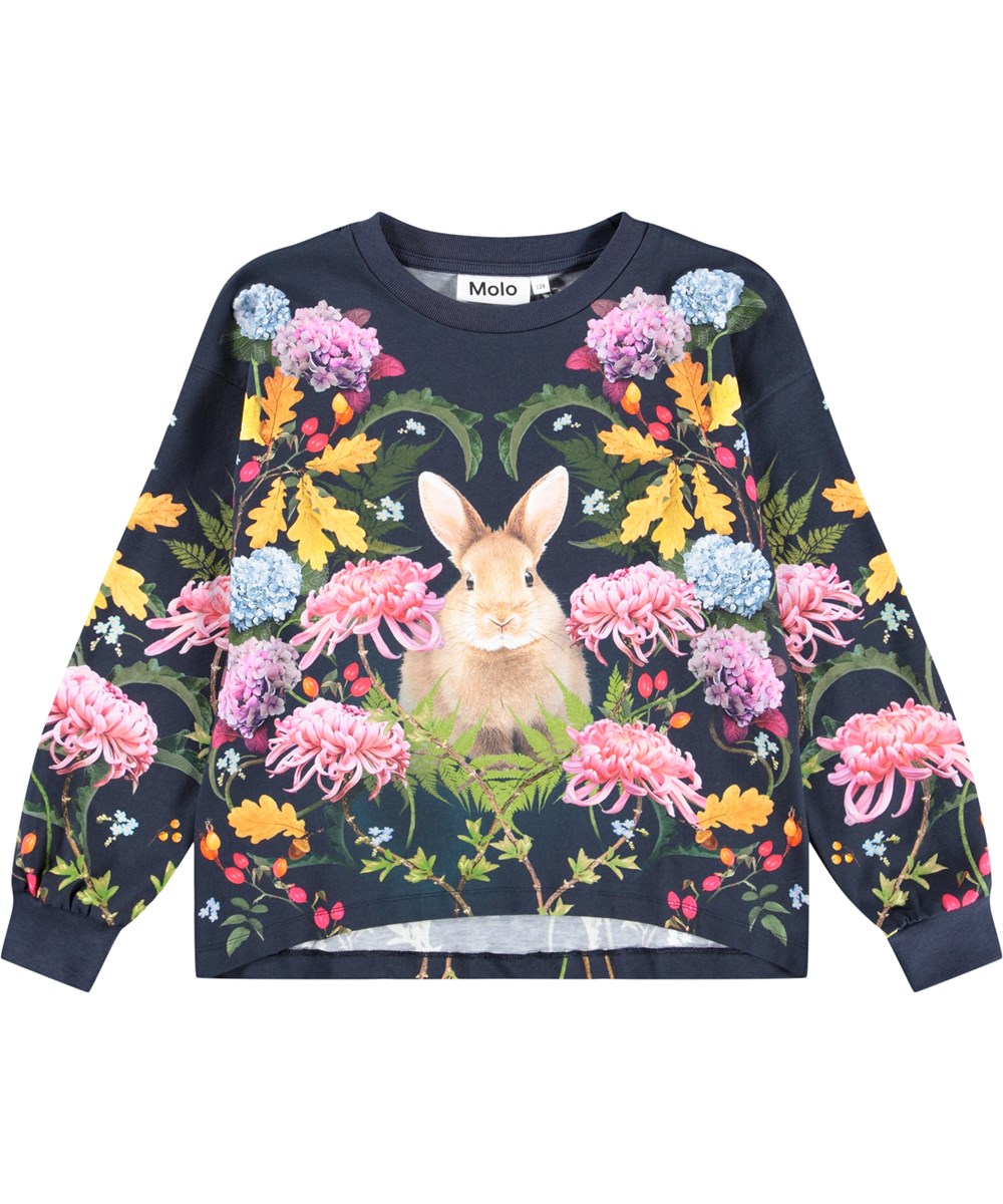 Reniza - Nouveau Rabbit - Dark blue long-sleeved top for children made of soft organic cotton with ribbed cuffs and neckline and a print of a rabbit surrounded by colorful flowers.