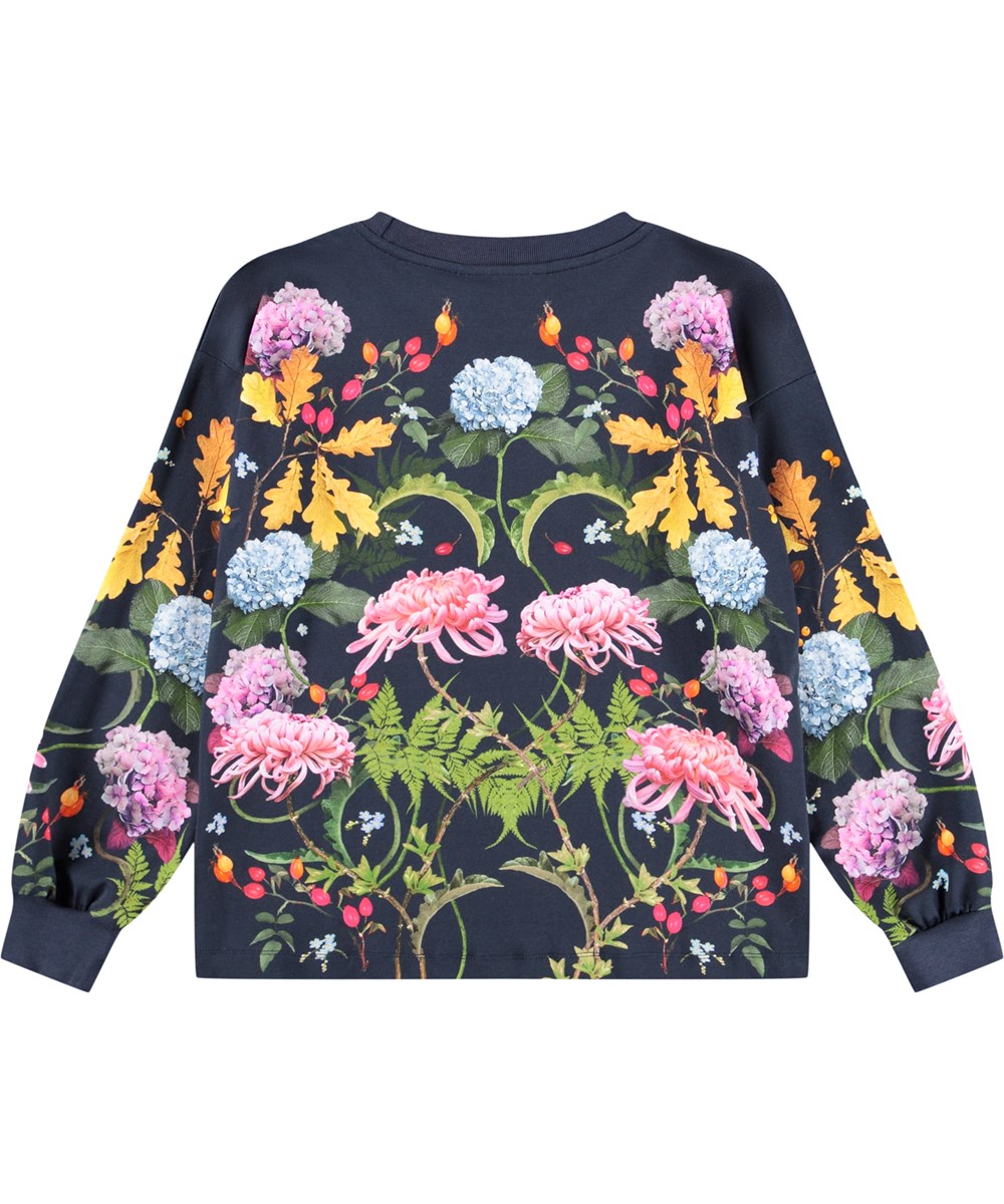 Reniza - Nouveau Rabbit - Dark blue long-sleeved top for children made of soft organic cotton with ribbed cuffs and neckline and a print of a rabbit surrounded by colorful flowers.