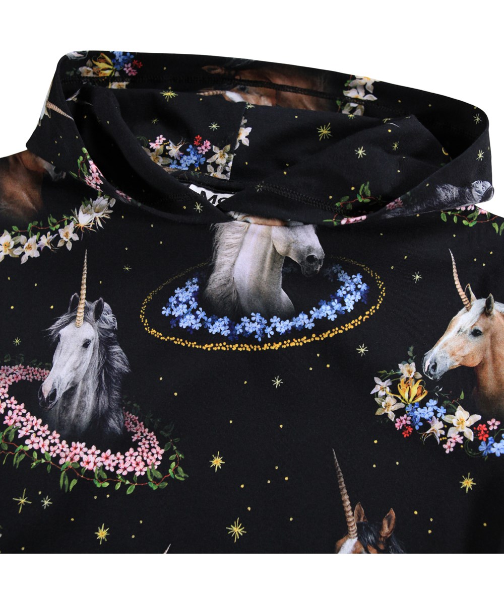 Rhona - Magical Galaxies - Black hoodie for children made of soft, organic cotton with a print of pegasi with colorful flower garlands.