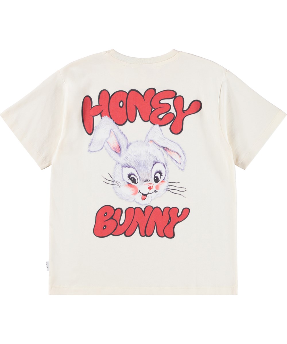 Riley - Buttercream - Off-white short-sleeved T-shirt for children made of soft organic cotton with a ribbed neckline.