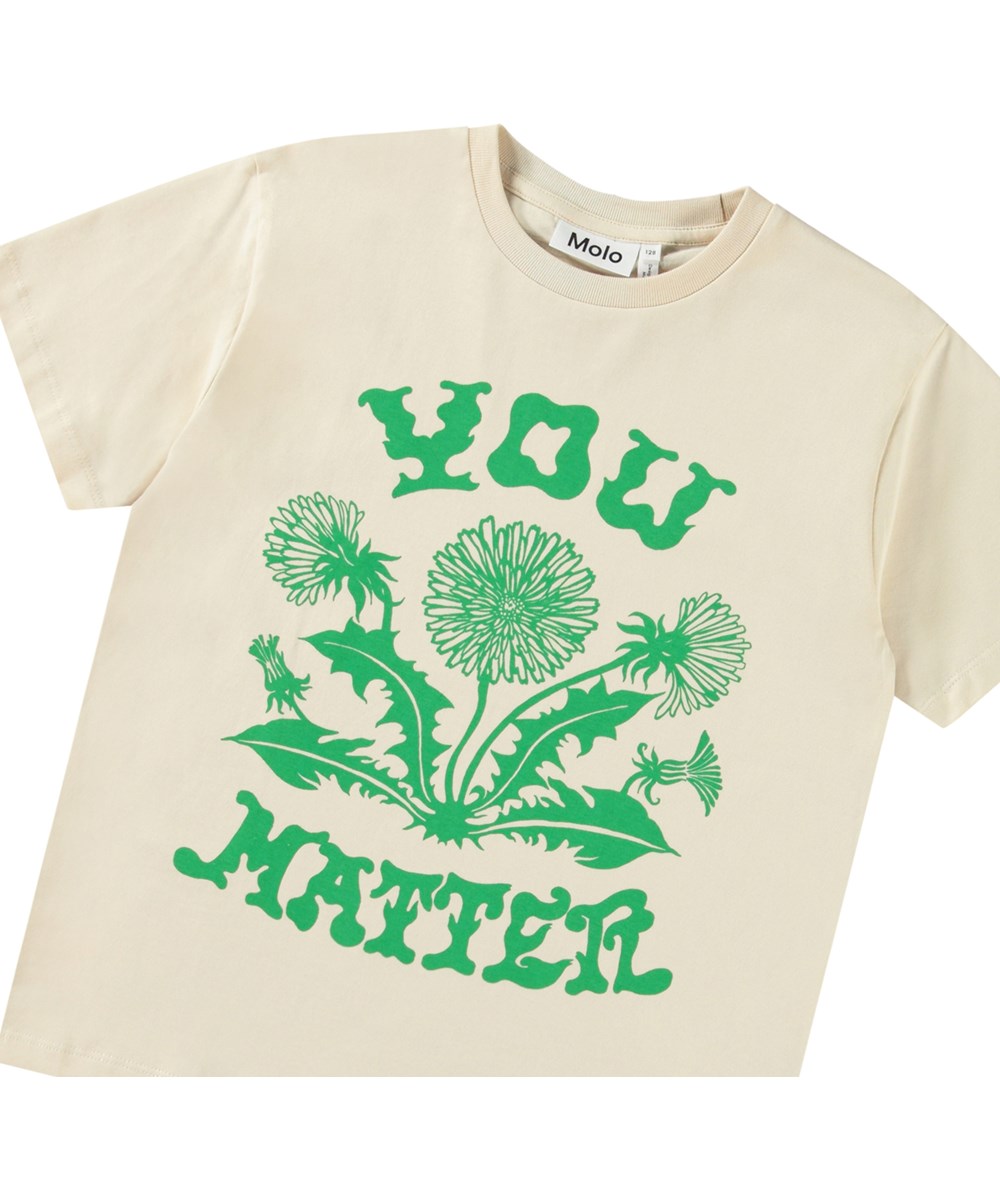 Riley - Green Dandelion - Off-white t-shirt with print for children in soft organic cotton with short sleeves and ribbed neckline.