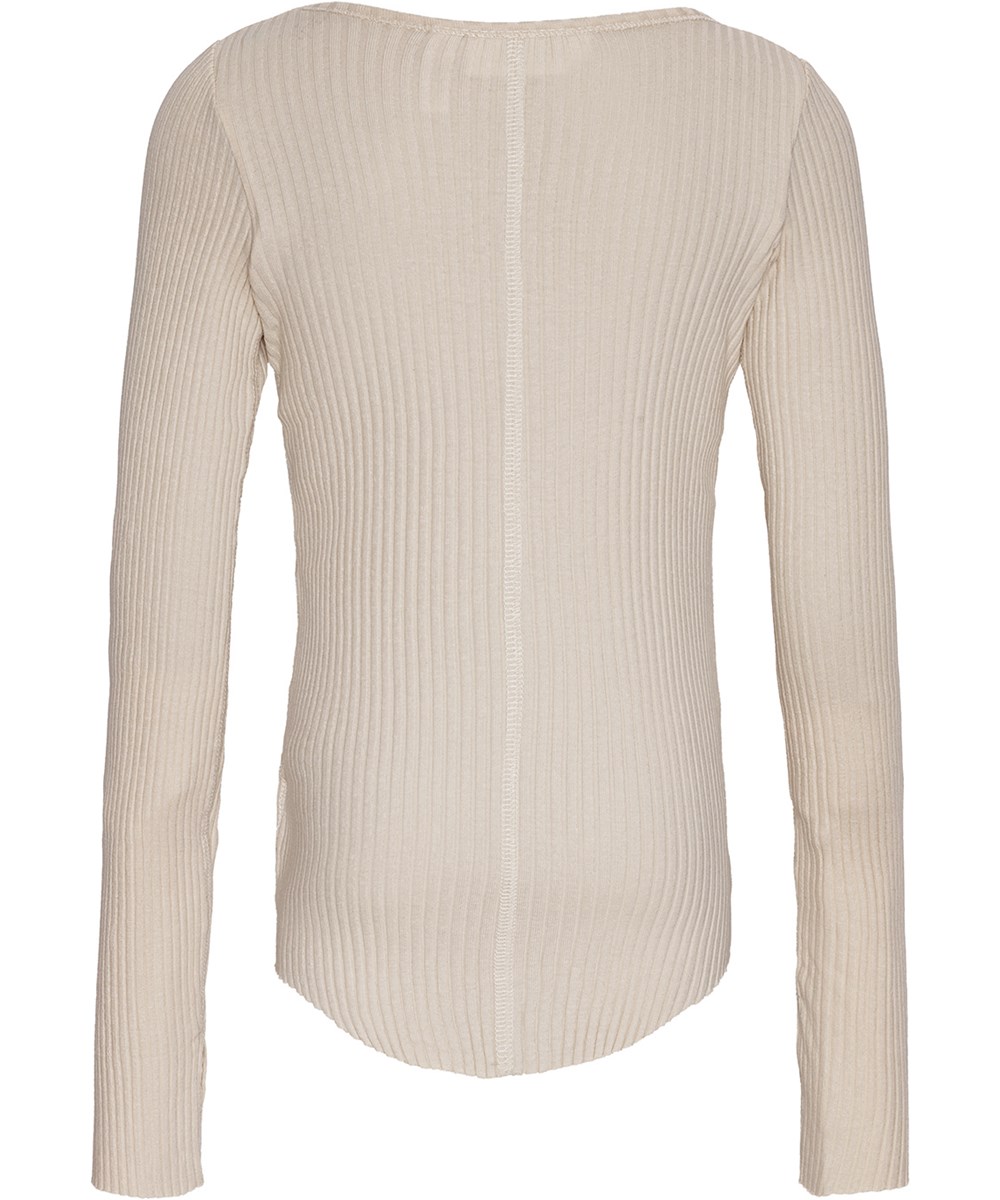 Rochelle - Whisper Pink - Off-white long-sleeved top in stretchy organic cotton rib with snug fit, round neckline, raw edges on sleeves with thumbholes.