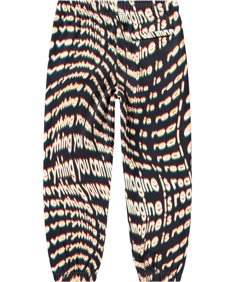 Adan - Everything Is - Biologische katoenen joggingbroek met een all-over vervaagde tekstprint.